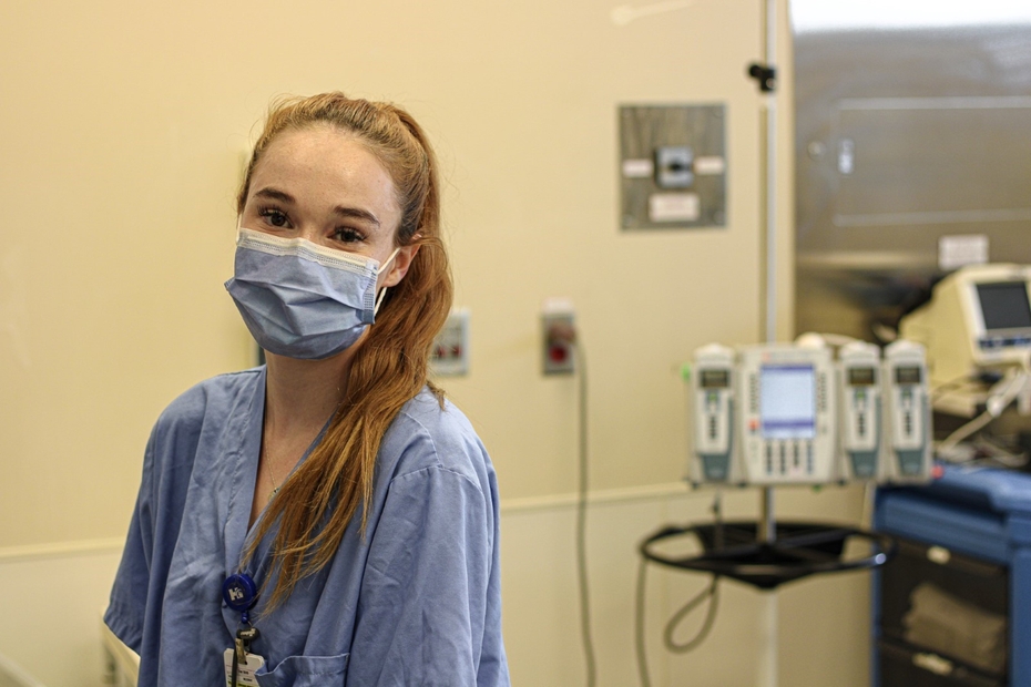 Maya Ouellette, fourth-year BScN student from St. Lawrence College, Cornwall campus, is pictured wearing scrubs and a face mask in a hospital room at CCH